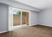 Thumbnail 9 of 15 - a bedroom with a large window and a balcony